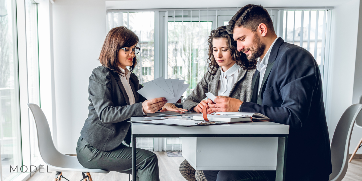 Stock models portray a financial planning appointment oms partners llc